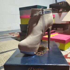 Gently used heeled boots in the color gray